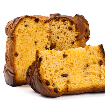 A sliced Panettone showing a moist, golden-yellow crumb filled with dried fruit, colored with BioconColors natural colorants like Beta-Carotene or Annatto.